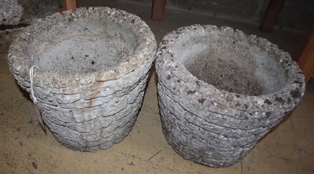 A pair of circular reconstituted stone brick effect garden planters, 28cm diameter, H.24cm